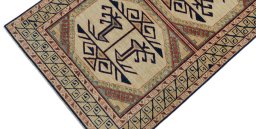 Backside of handmade New Kazak rug showing knot structure and weave density