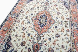 Backside of handmade 2000s Kashan rug showing knot structure and weave density