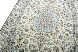 Backside of handmade 2000s Nain rug showing knot structure and weave density