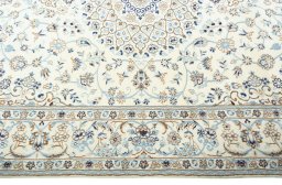 Corner detail of New Nain rug showing border pattern and Wool pile