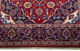 Close-up detail of 2000s Kashan rug from Iran / Persia showing Wool weave
