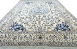 Surface texture of 2000s Nain rug with natural Wool and intricate pattern