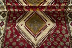 Full view of 1970s Persian Gabbeh rug from Iran / Persia, 235 × 137 cm in Red tones