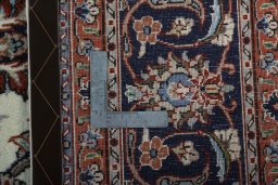 Backside of handmade 2000s Mashad rug showing knot structure and weave density