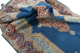 Surface texture of 2000s Kerman rug with natural Wool and intricate pattern