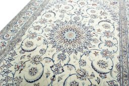 Backside of handmade 2000s Nain rug showing knot structure and weave density