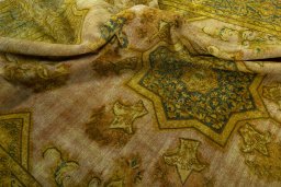 Surface texture of 1950s Vintage rug with natural Wool and intricate pattern