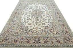 Surface texture of 2000s Kashan rug with natural Wool and intricate pattern