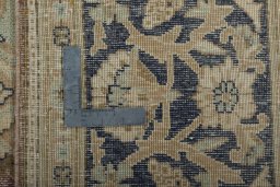 Backside of handmade 1950s Vintage rug showing knot structure and weave density