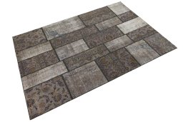 Corner detail of 1960s Patchwork rug showing border pattern and Wool pile