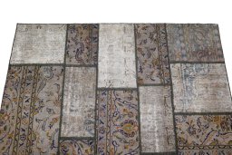 Surface texture of 1960s Patchwork rug with natural Wool and intricate pattern