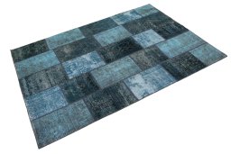 Corner detail of 1960s Patchwork rug showing border pattern and Wool pile