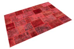 Corner detail of 1960s Patchwork rug showing border pattern and Wool pile
