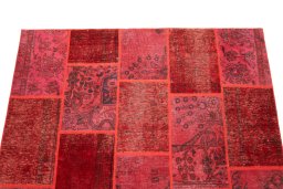 Surface texture of 1960s Patchwork rug with natural Wool and intricate pattern