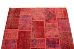 Surface texture of 1960s Patchwork rug with natural Wool and intricate pattern