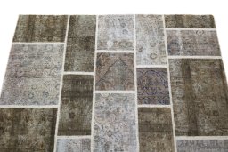 Surface texture of 1960s Patchwork rug with natural Wool and intricate pattern
