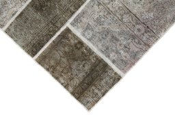 Backside of handmade 1960s Patchwork rug showing knot structure and weave density