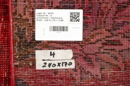 Corner detail of 1960s Patchwork rug showing border pattern and Wool pile