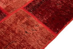 Backside of handmade 1960s Patchwork rug showing knot structure and weave density