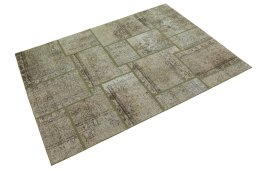 Corner detail of 1960s Patchwork rug showing border pattern and Wool pile