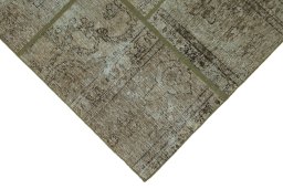 Backside of handmade 1960s Patchwork rug showing knot structure and weave density