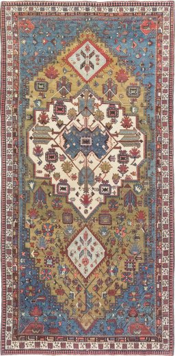 Full view of 1900s Vintage rug from Iran / Persia, 562 × 273 cm in Green tones