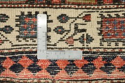 Corner detail of 1900s Vintage rug showing border pattern and Wool pile