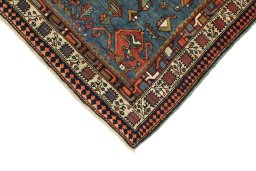 Backside of handmade 1900s Vintage rug showing knot structure and weave density