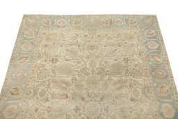 Surface texture of 1920s Vintage rug with natural Wool and intricate pattern