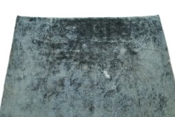 Surface texture of 1940s Vintage rug with natural Wool and intricate pattern