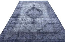 Surface texture of 1970s Vintage rug with natural Wool and intricate pattern