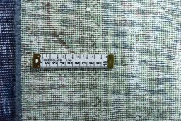 Backside of handmade 1970s Vintage rug showing knot structure and weave density