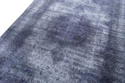 Backside of handmade 1970s Vintage rug showing knot structure and weave density