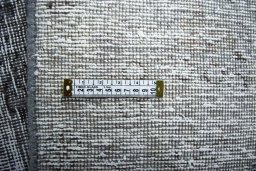Backside of handmade 1970s Vintage rug showing knot structure and weave density