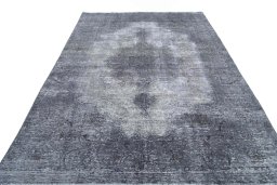 Surface texture of 1970s Vintage rug with natural Wool and intricate pattern
