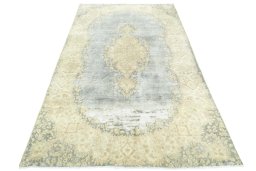 Surface texture of 1970s Vintage rug with natural Wool and intricate pattern
