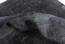 Surface texture of 1970s Vintage rug with natural Wool and intricate pattern