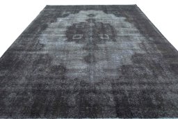 Surface texture of 1970s Vintage rug with natural Wool and intricate pattern