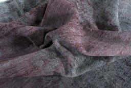 Surface texture of 1970s Vintage rug with natural Wool and intricate pattern