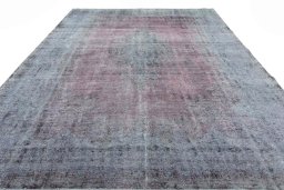 Surface texture of 1970s Vintage rug with natural Wool and intricate pattern