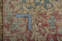 Backside of handmade 1950s Vintage rug showing knot structure and weave density