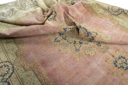 Surface texture of 1950s Vintage rug with natural Wool and intricate pattern