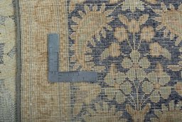 Backside of handmade 1970s Vintage rug showing knot structure and weave density