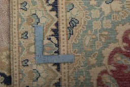 Backside of handmade 1970s Vintage rug showing knot structure and weave density