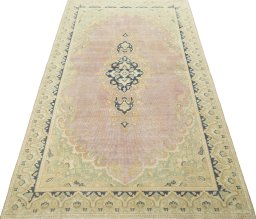 Surface texture of 1970s Vintage rug with natural Wool and intricate pattern