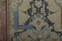 Backside of handmade 1950s Vintage rug showing knot structure and weave density