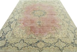 Surface texture of 1950s Vintage rug with natural Wool and intricate pattern