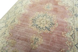 Backside of handmade 1950s Vintage rug showing knot structure and weave density