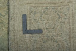Backside of handmade 1970s Vintage rug showing knot structure and weave density