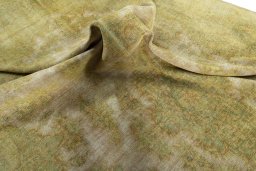 Surface texture of 1970s Vintage rug with natural Wool and intricate pattern